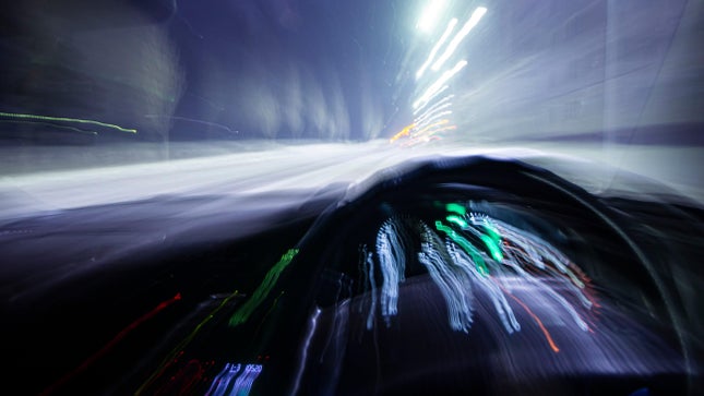 Blurry interior image of a speeding car